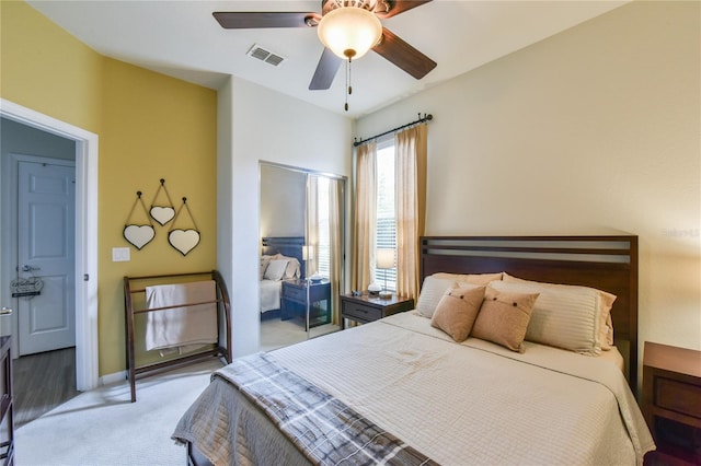 carpeted bedroom with ceiling fan