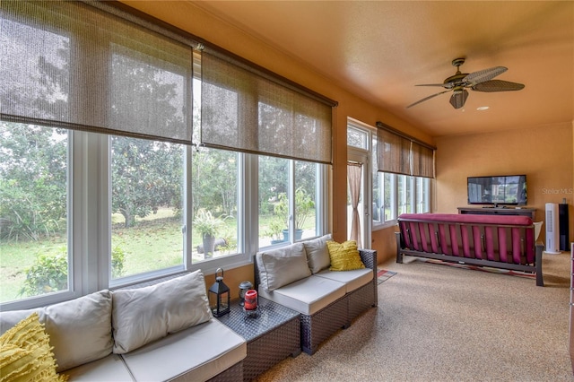 sunroom / solarium featuring ceiling fan and a wealth of natural light