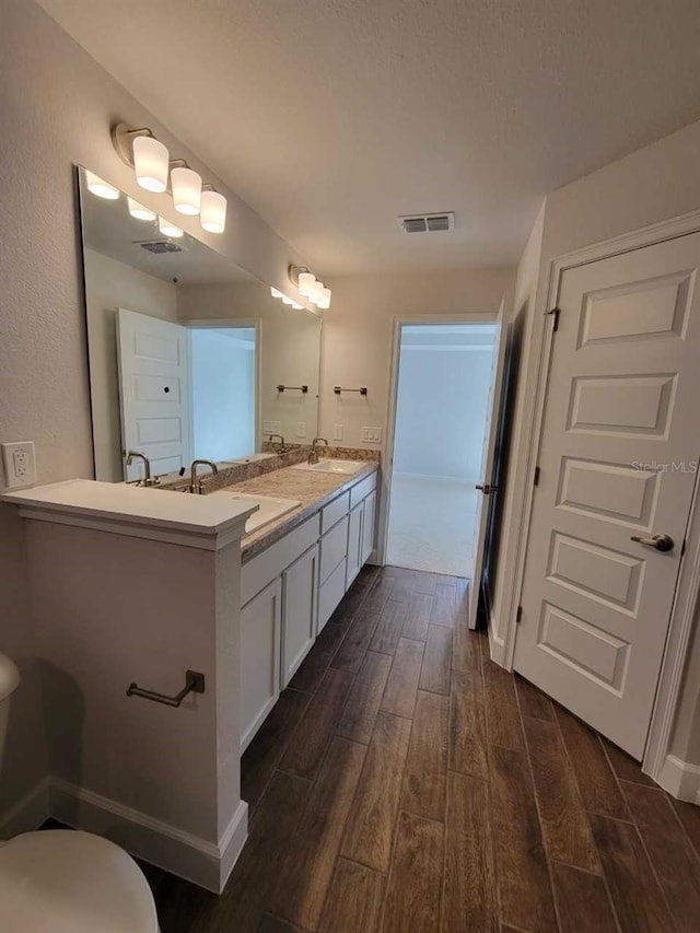 bathroom featuring hardwood / wood-style floors and vanity