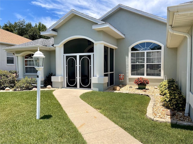 entrance to property with a yard