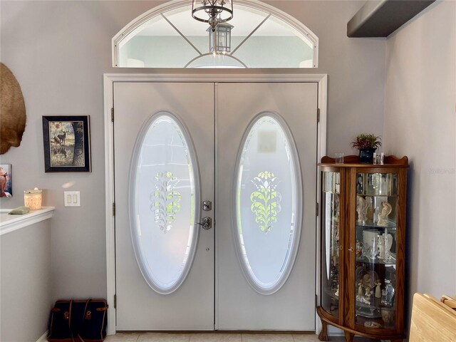 tiled entrance foyer with french doors