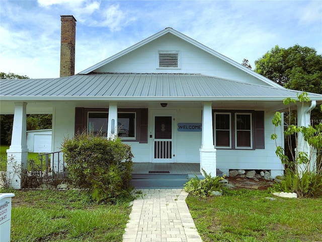 view of front of home with a garage and covered porch