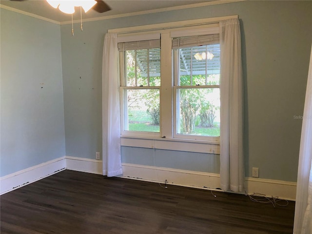 unfurnished room featuring ceiling fan, dark hardwood / wood-style flooring, and ornamental molding