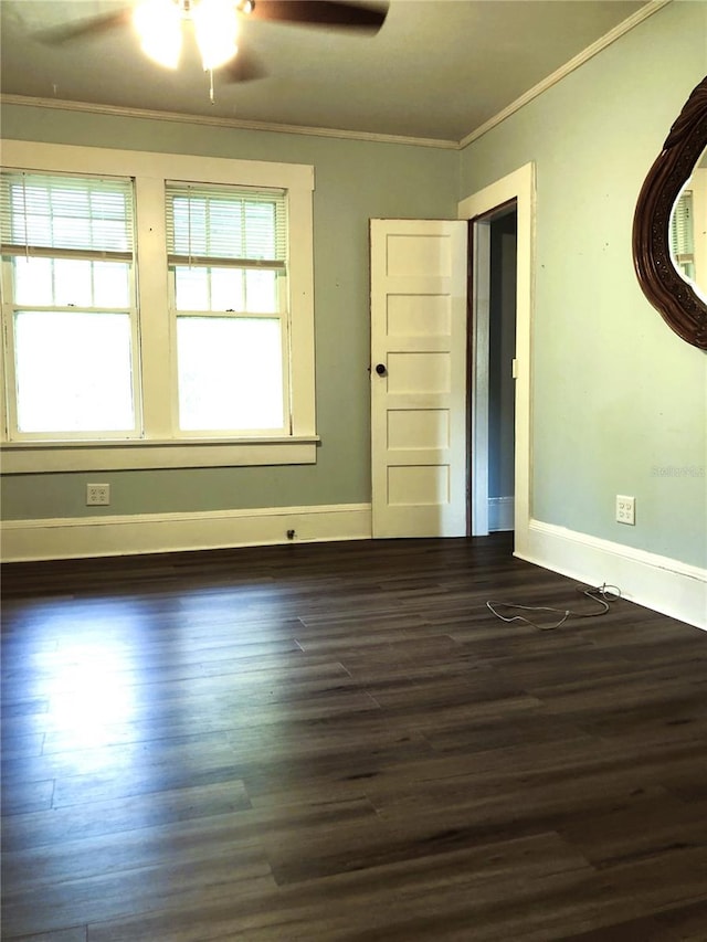 spare room featuring ornamental molding, ceiling fan, and dark hardwood / wood-style floors