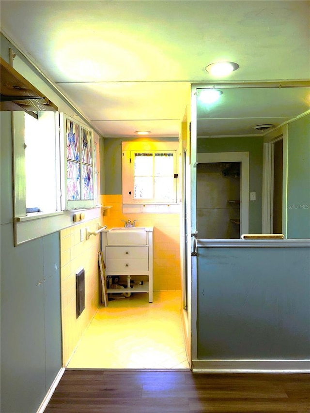 interior space with hardwood / wood-style floors and sink