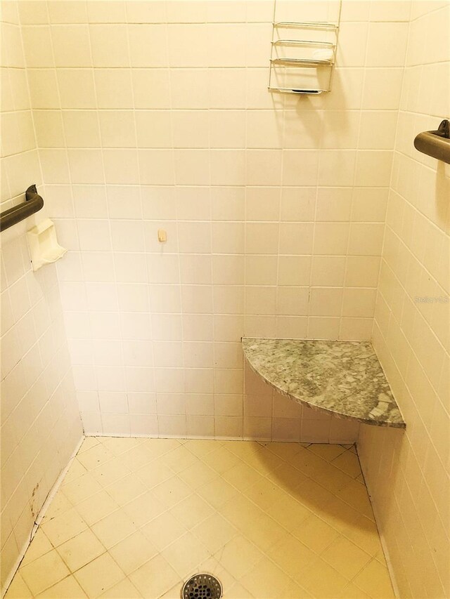 bathroom with tiled shower