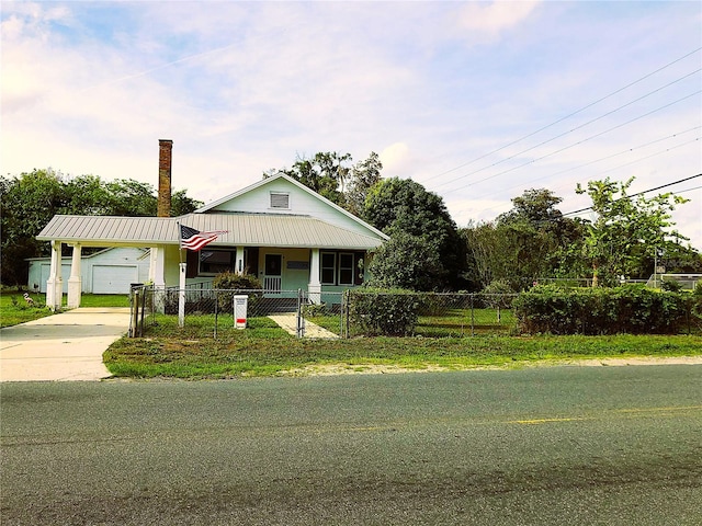 view of front of house featuring a garage and a front lawn