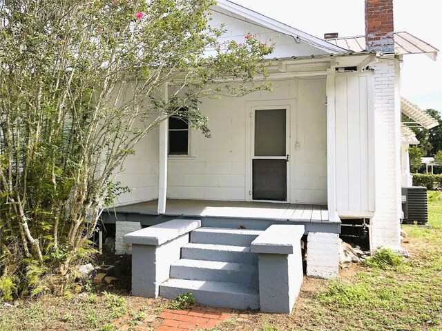 rear view of property featuring cooling unit