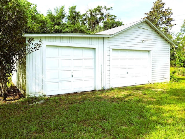 garage with a lawn