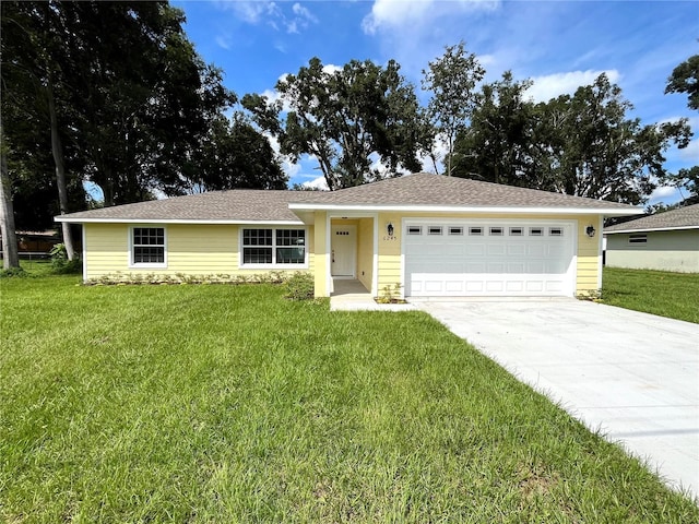 ranch-style house with a front lawn and a garage