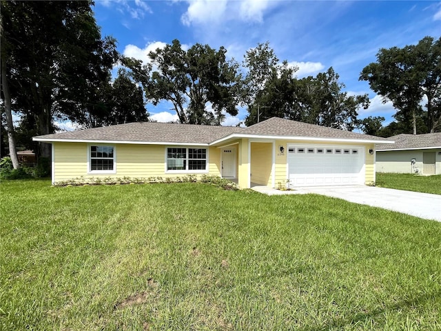 ranch-style house with a garage and a front yard