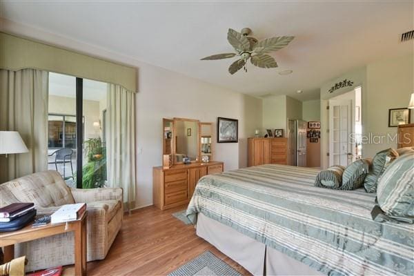 bedroom with access to outside, ceiling fan, and light wood-type flooring