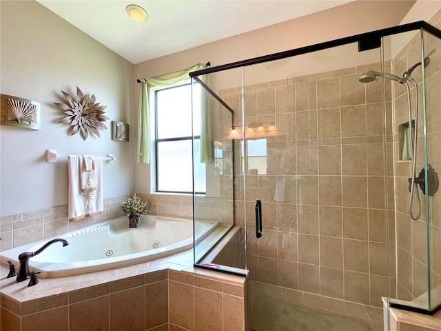 bathroom with shower with separate bathtub