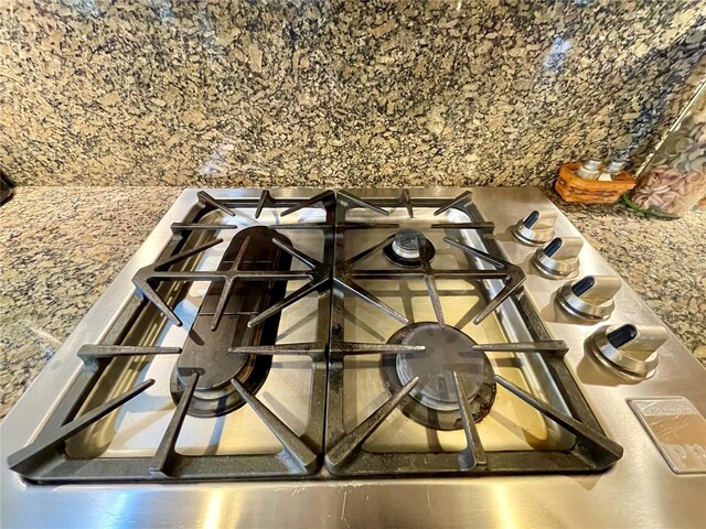 room details featuring range and stainless steel gas stovetop