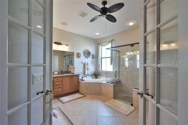 bathroom featuring french doors, vanity, ceiling fan, tile patterned flooring, and shower with separate bathtub