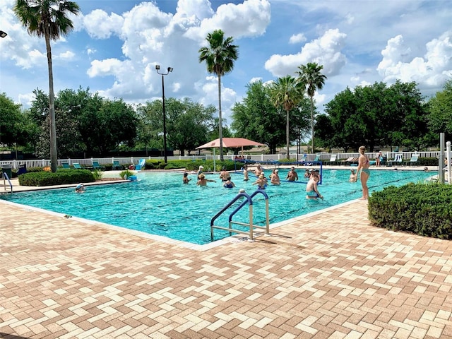 view of swimming pool featuring a patio area