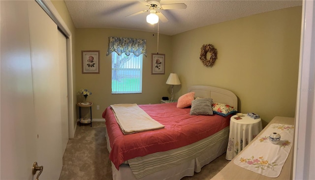 bedroom featuring a textured ceiling, carpet, and ceiling fan