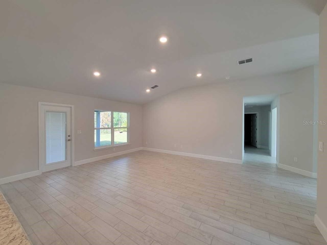 5243 SW 106th St, Ocala, FL 34476 - unfurnished room with recessed lighting, light wood-style floors, baseboards, and vaulted ceiling
