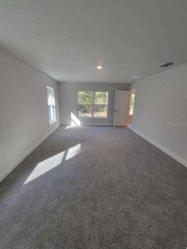 5243 SW 106th St, Ocala, FL 34476 - spare room with baseboards, carpet, and recessed lighting