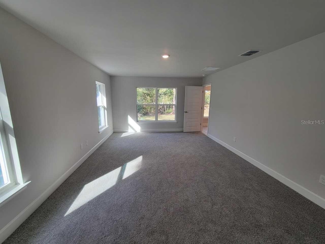 unfurnished living room featuring carpet