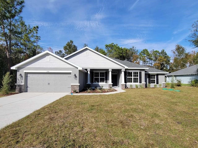 single story home with a garage and a front lawn