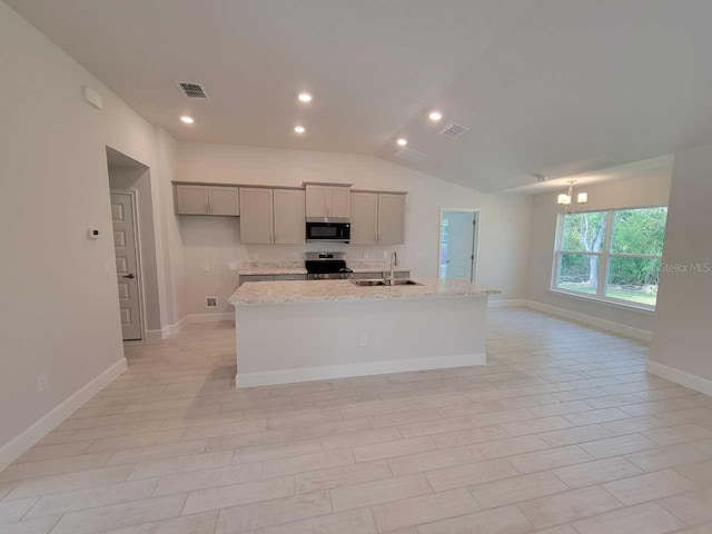5243 SW 106th St, Ocala, FL 34476 - kitchen with appliances with stainless steel finishes, gray cabinets, a sink, a chandelier, and a kitchen island with sink