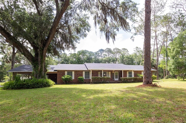 ranch-style home featuring a front yard