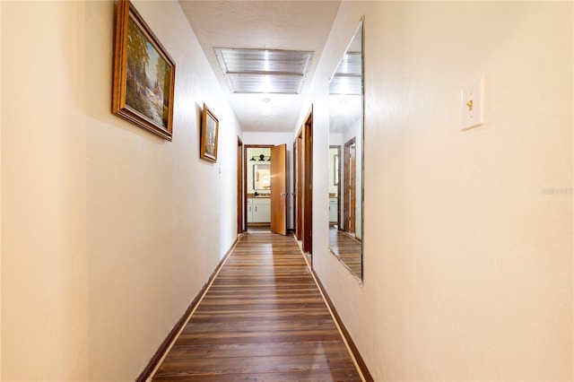 hallway featuring dark hardwood / wood-style floors