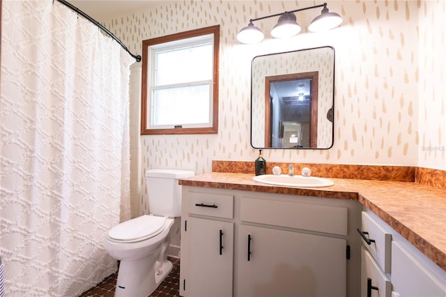 bathroom with walk in shower, tile patterned flooring, vanity, and toilet