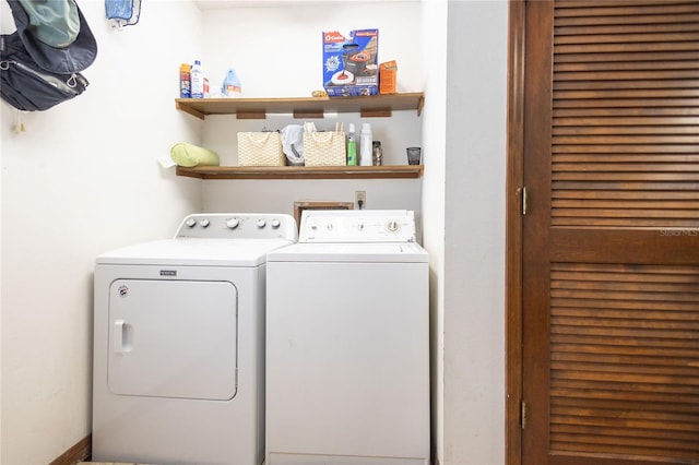 washroom with washing machine and dryer