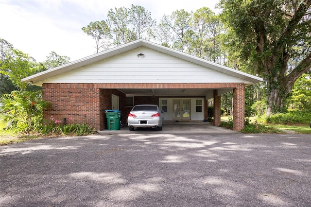 exterior space featuring a carport and french doors