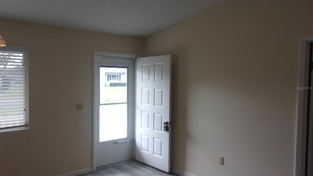 entrance foyer with a textured ceiling