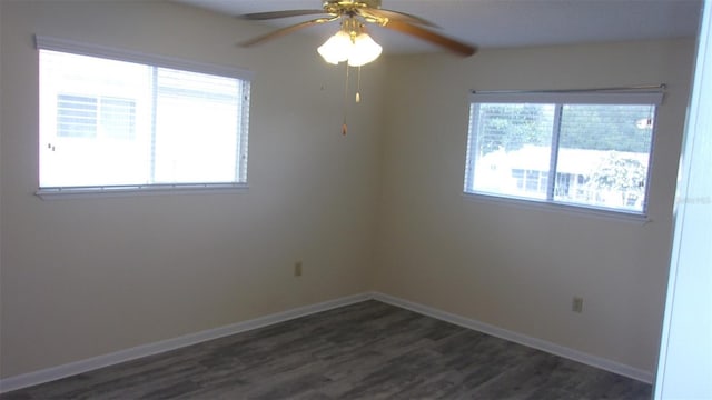 unfurnished room featuring ceiling fan and dark hardwood / wood-style floors