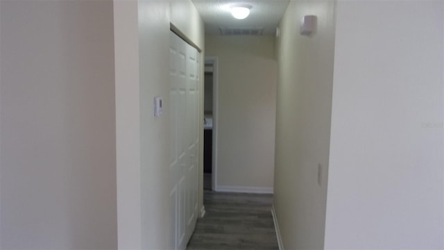 hall with dark hardwood / wood-style floors