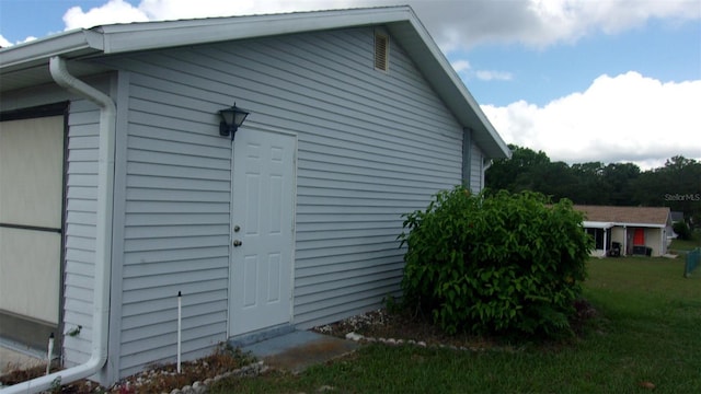 view of side of property with a lawn