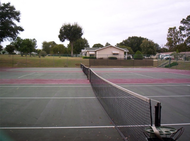 view of sport court featuring basketball hoop