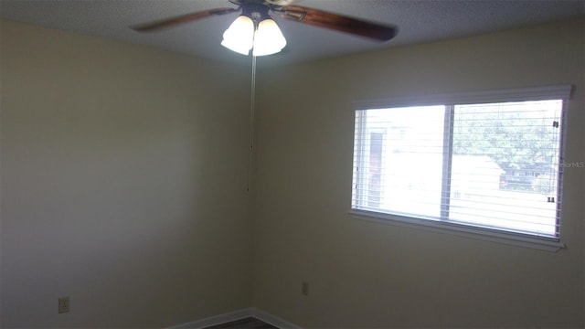 empty room featuring ceiling fan