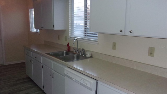 kitchen with dark hardwood / wood-style flooring, white dishwasher, white cabinetry, and sink