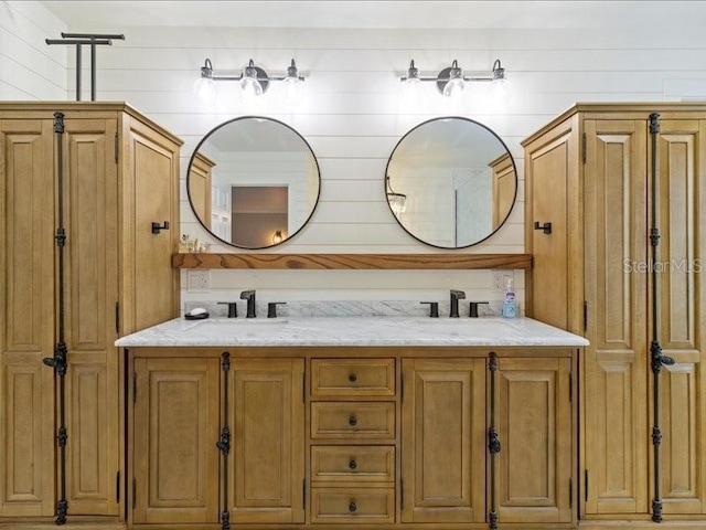 bathroom with wooden walls and vanity