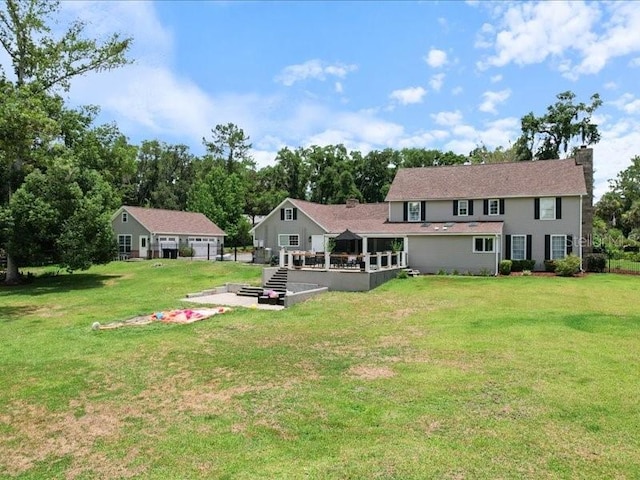 back of house with a yard