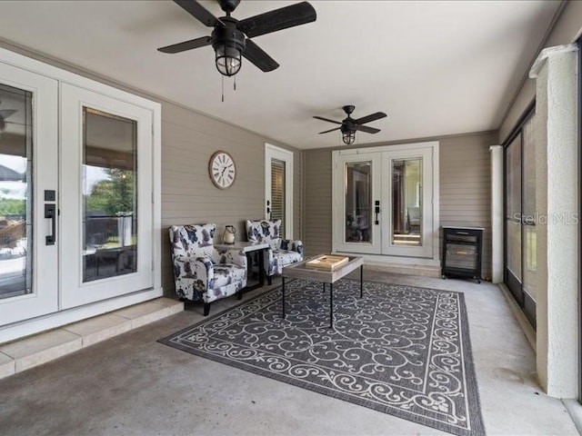 sunroom / solarium with french doors and ceiling fan