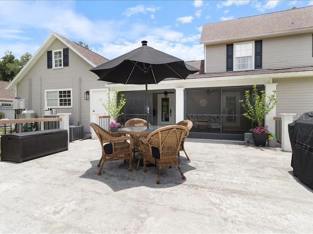 view of patio / terrace featuring a sunroom and cooling unit