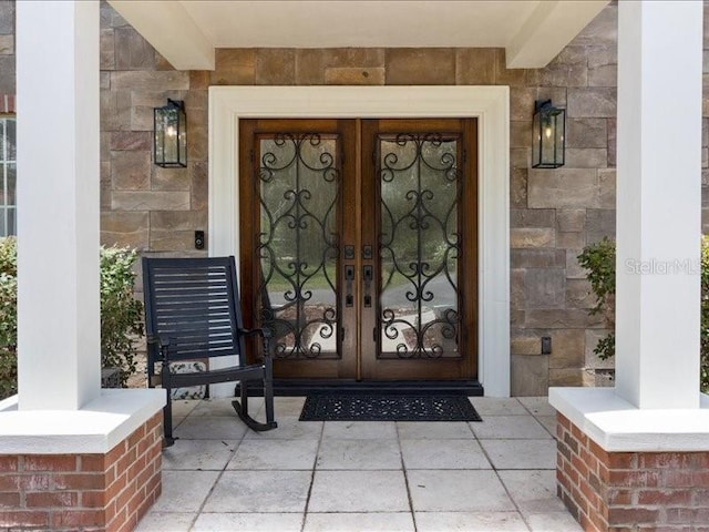 entrance to property featuring french doors