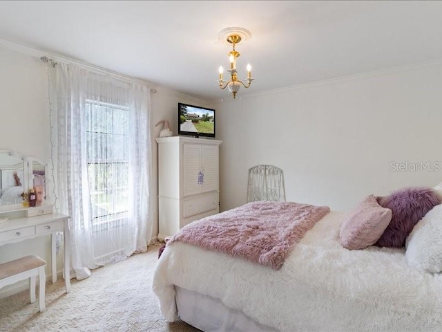 carpeted bedroom featuring crown molding and an inviting chandelier