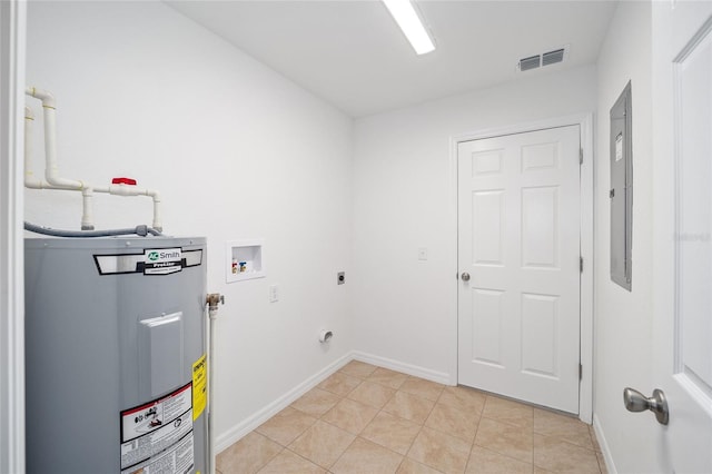 laundry room featuring hookup for an electric dryer, electric water heater, light tile patterned floors, and washer hookup