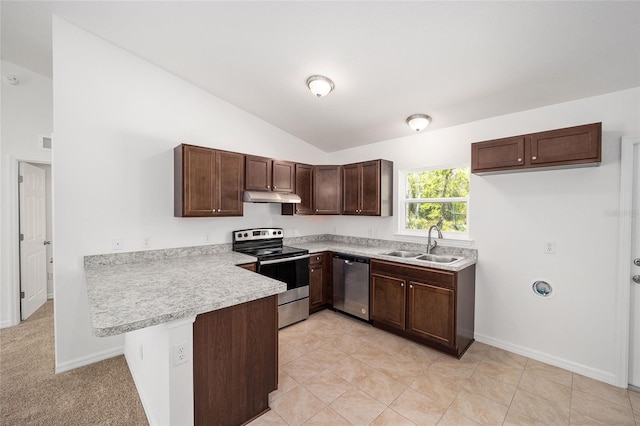 kitchen with dark brown cabinetry, sink, stainless steel appliances, kitchen peninsula, and lofted ceiling