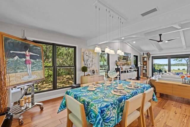 dining area featuring vaulted ceiling, light hardwood / wood-style flooring, ceiling fan, and plenty of natural light