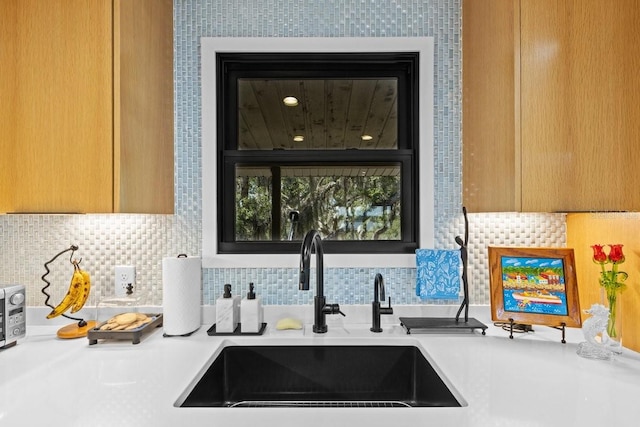 kitchen with decorative backsplash and sink