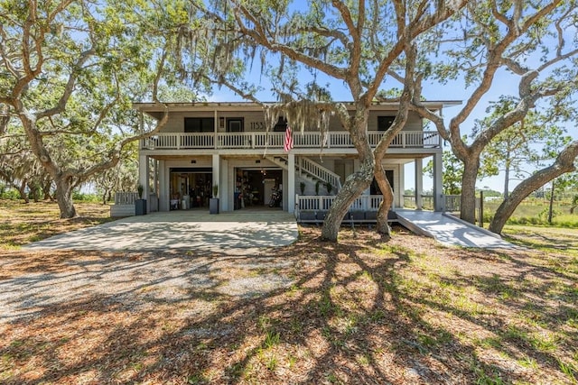 beach home with a porch and a garage