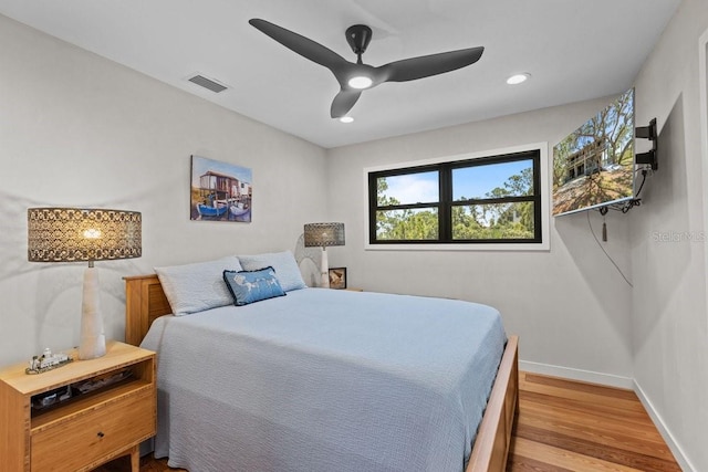 bedroom featuring ceiling fan and light hardwood / wood-style flooring